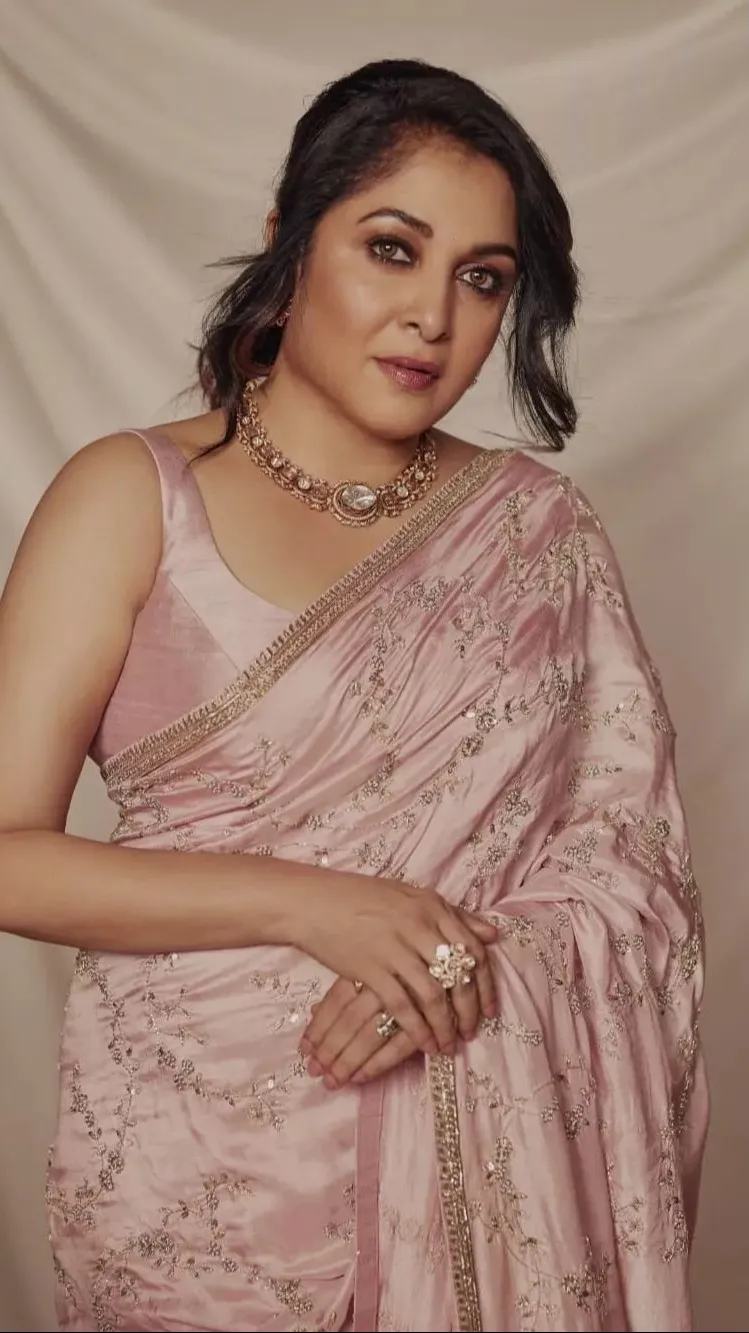 ai character: Ramya Krishna background