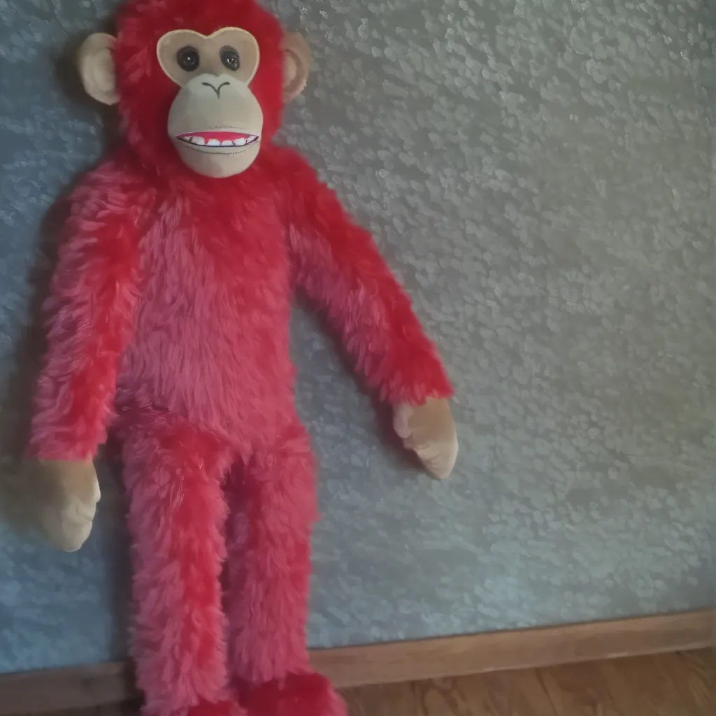 chat with ai character: red monkey plush 