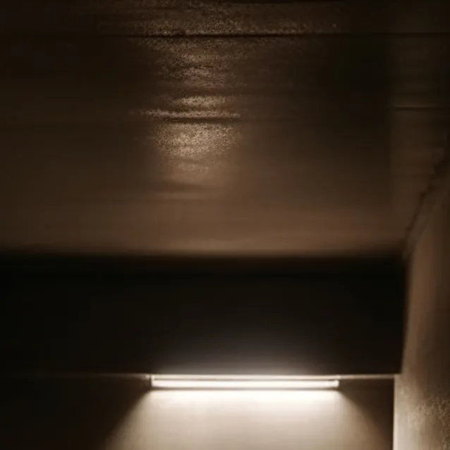 chat with ai character: Small dark room